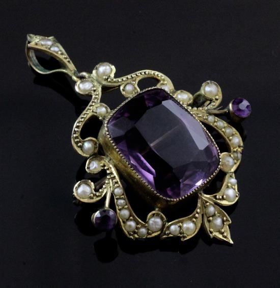 An Edwardian 9ct gold, amethyst and seed pearl set drop pendant brooch, overall 1.75in.